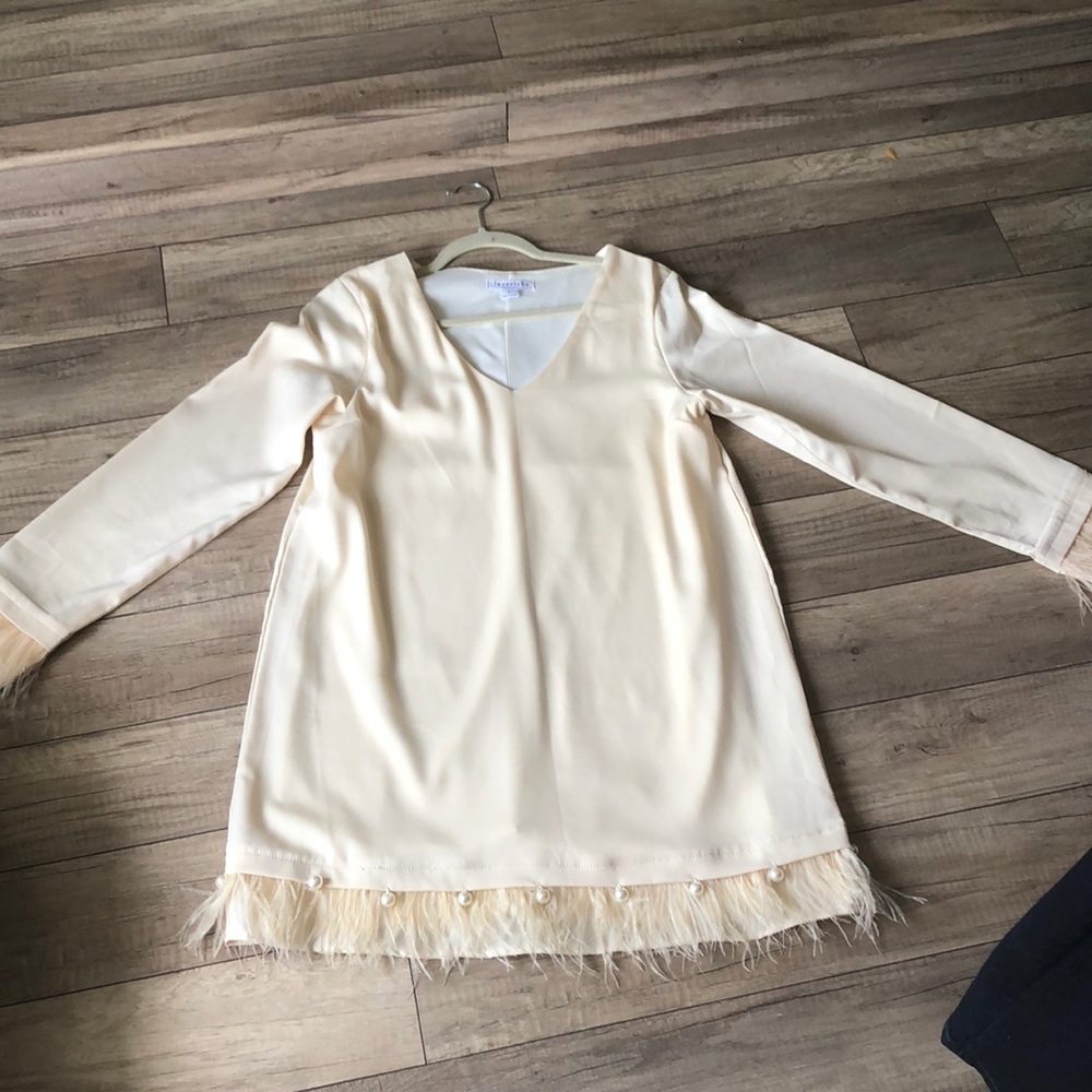 A little feather and pearls will do just nicely!